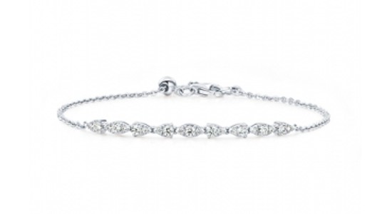 a delicate diamond bracelet featuring a fine chain