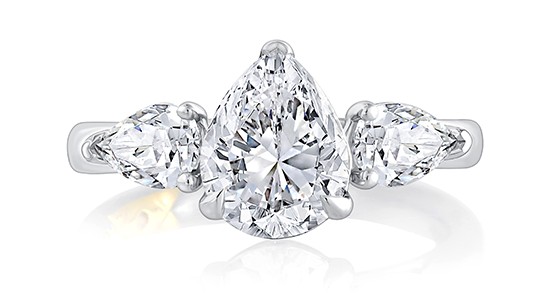 a white gold, three stone engagement ring with three pear shape diamonds