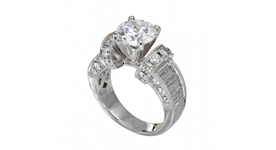 an elaborately designed white gold engagement ring