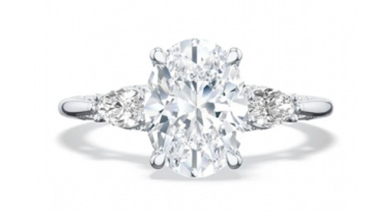 A three stone TACORI engagement ring with an oval cut center stone, available at Rogers Jewelry Co.