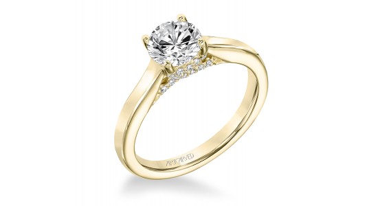 A yellow gold hidden halo engagement ring from ArtCarved, available at Rogers Jewelry Co.