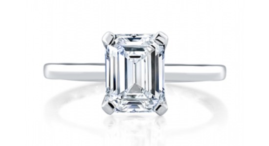 A solitaire engagement ring with an emerald cut center stone from A.JAFFE, available at Rogers Jewelry Co.