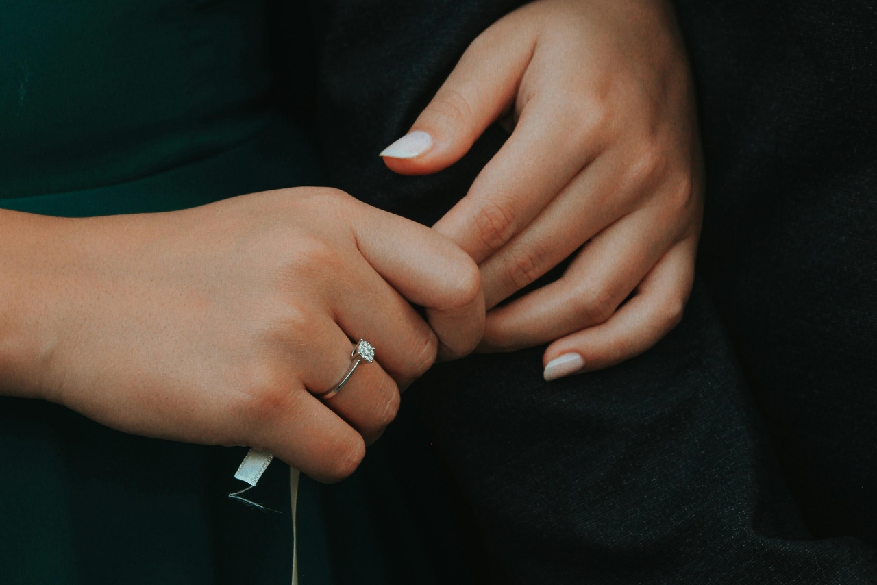 A white gold ring with a princess cut diamond for its solitaire setting.