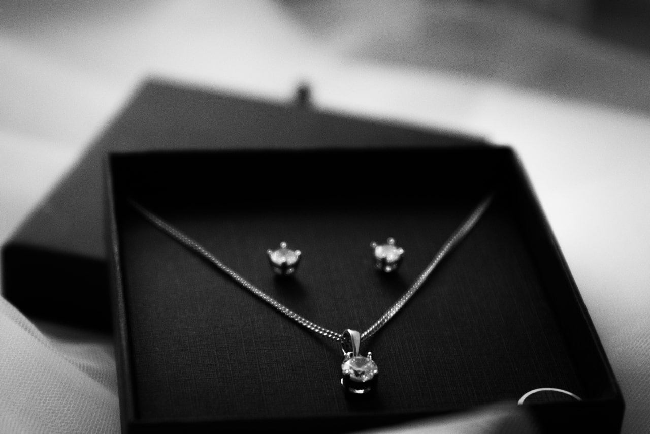 Diamond stud earrings and diamond pendant necklace as a gift for someone you care about