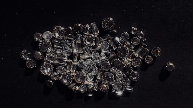 an assortment of diamonds on a black background