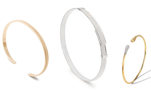 A close-up of three slim and subtle bangle bracelets, all available at Rogers Jewelry Co.