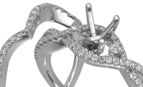 A close-up of a JYE palladium wedding set, the engagement ring featuring space for a custom center stone, available at Rogers Jewelry Co..