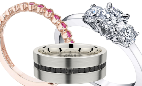 A close-up view of three pieces of designer bridal jewelry, one engagement ring and two wedding bands, all available at Rogers Jewelry Co.