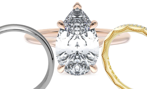 A close-up view of three pieces of designer bridal jewelry, one engagement ring and two wedding bands, all available at Rogers Jewelry Co.