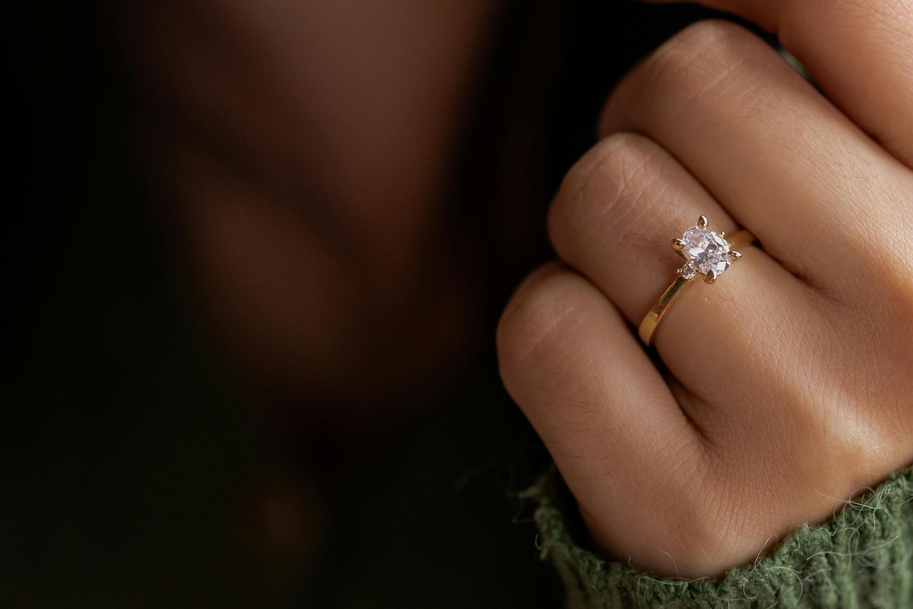 A woman wearing solitaire engagement ring A woman wearing solitaire engagement ring